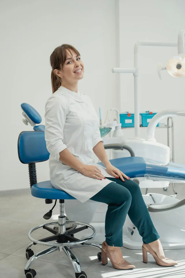 Professional dentist smiling in her clinic